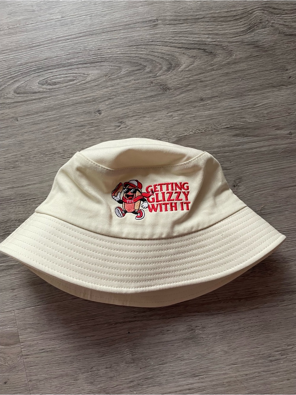 TFC Cream Bucket Hat with 'Getting Glizzy With It' Embroidery